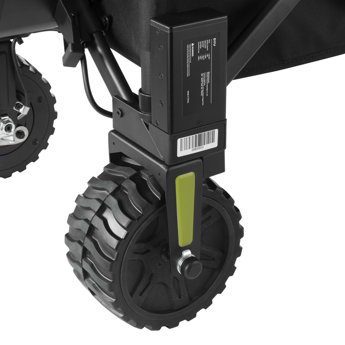 DYU CampX, gros plan sur la roue avec boîtier noir, étiquette et code-barres, et détail vert sur le support de roue