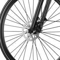 OneSport OT12 Pro, gros plan sur le frein à disque de la roue avant, la fourche avant et les rayons