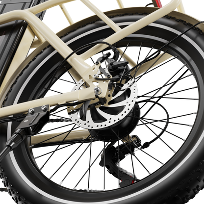 OneSport OT16 Pro, gros plan sur la roue arrière avec frein à disque, rayons et dérailleur près du cadre beige