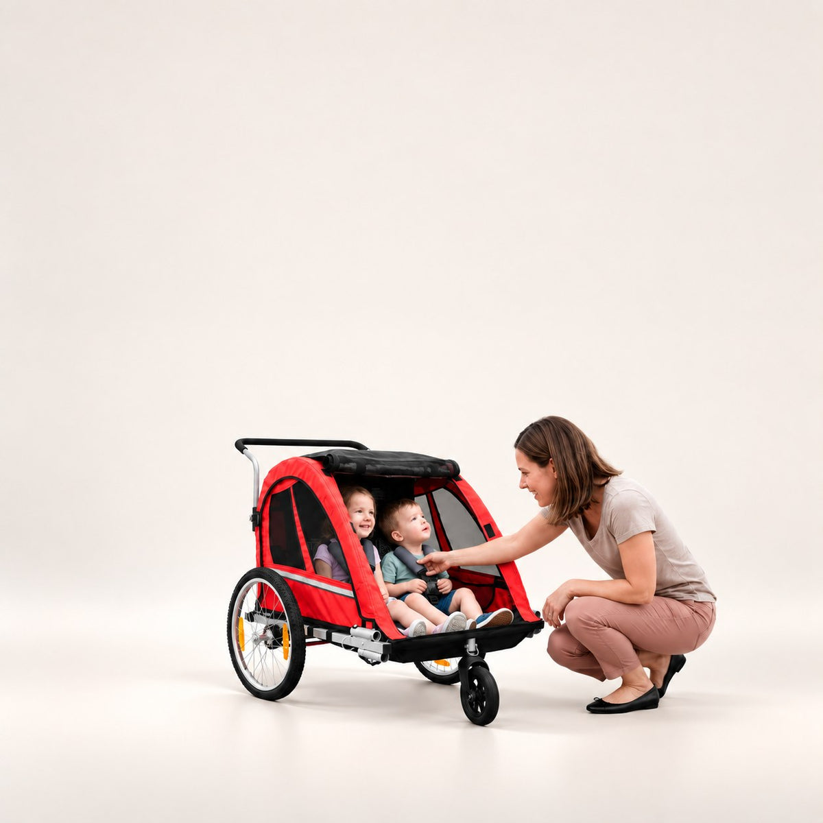 Remorque vélo pour vélos électriques chez Wheelyshop – remorque rouge avec deux enfants